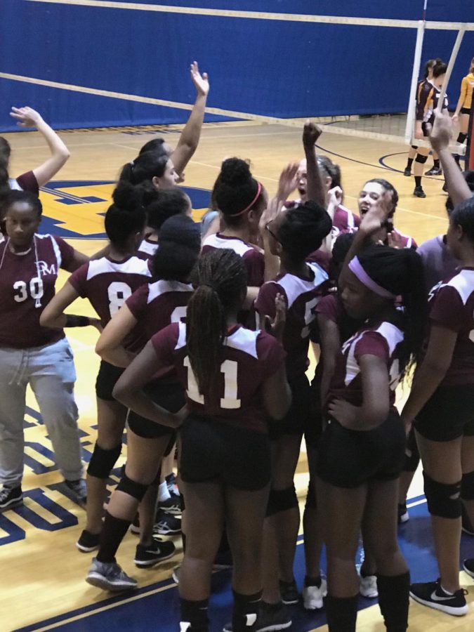 The volleyball team enjoying their win.