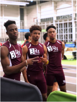 Seniors Quanzie Lumsden, Cedric Martin, and Andrew Jones at a meet